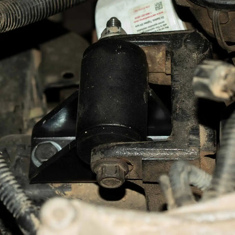 A close-up photo of the 1-inch lift motor mount installed on a vehicle.
